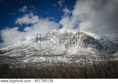 A Rock Mountain Covered By Snow Mount Timpanogos, Utah