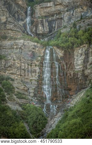 Two Waterfalls Coming Down Mountain Cliff During Summer