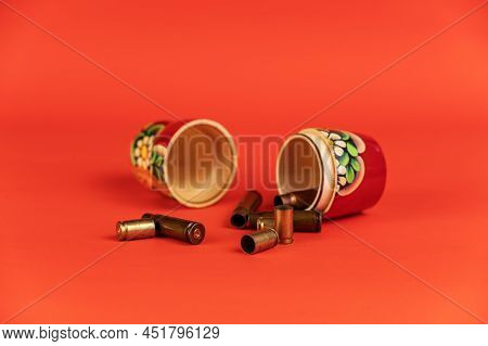 Matryoshka And Sleeves Against A Kora Background. Tradition Russian Symbol And Empty Pistol And Subm