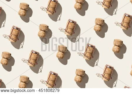 Pattern With Champagne Corks On Beige Background With Hard Light And Shadow At Sunlight. Summer Wine