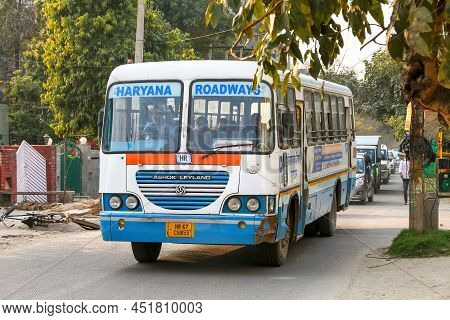 Gurgaon, India - March 3, 2022: Suburban Bus Ashok Leyland Viking In A City Street.