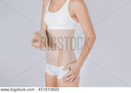 Lumbar Brace On The Human Body Isolated On A White Background. Trauma Of Back. Back Brace, Orthopedi