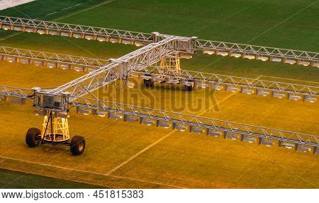 Assimilation Lighting In Soccer Stadium. Lighting Assimilation Off Grass. Aerial View Of Light Thera