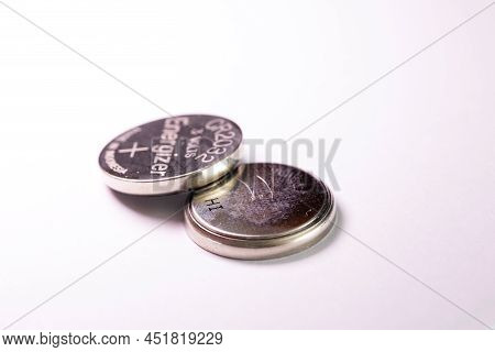 Brecht, Belgium - March 5 2022: A Studio Portrait Of Two Coin Cell, Button Or Watch Energizer Batter