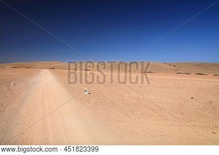 Agafay Desert Landscape Near Marrakech, Morocco. Desert Dirt Road.