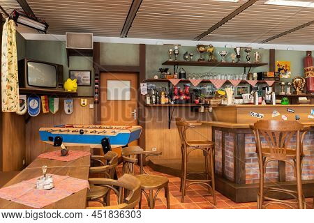 Schaerbeek, Brussels Capital Region, Belgium - 03 26 2022 - The Cafe With A Bar And Wooden Decoratio