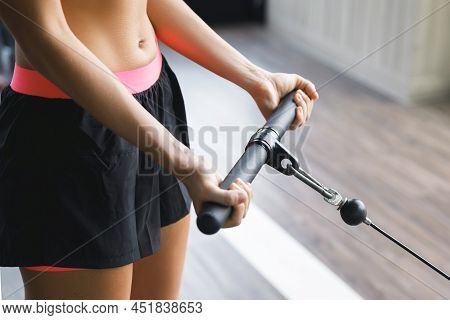 Woman Working Out In Gym. Bicep Curl Exercise.