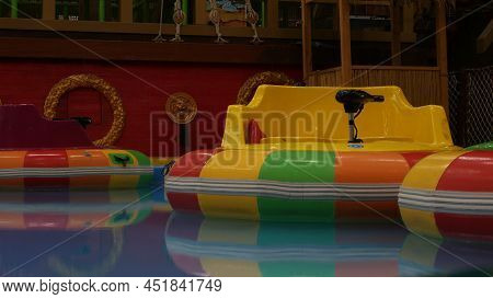 Inflatable Multi-colored Boats For Children With A Motor To Swim Around The Pool