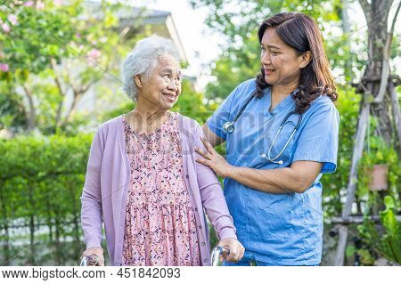 Doctor Help And Care Asian Senior Or Elderly Old Lady Woman Use Walker With Strong Health While Walk