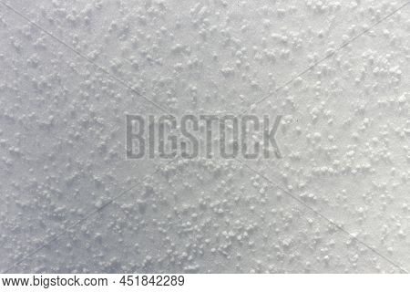 Close Up Of Graupel Snow Pellets, Formed When Supercooled Water Droplets Freeze Onto Snow Crystals