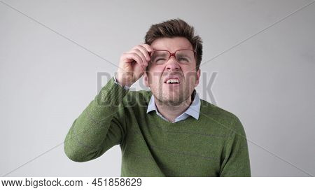 Curious Scrupulous Man Looks Attentively At One Point, Sees Something Strange Or .