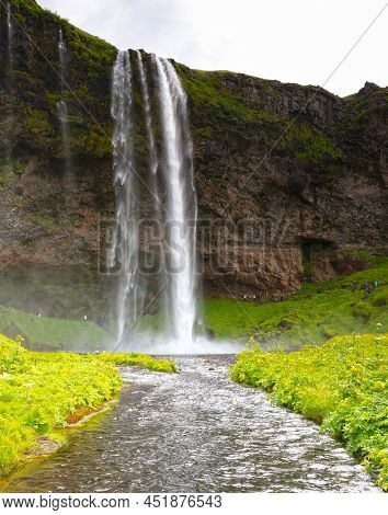 Seljalandfoss, Iceland - July 29, 2021: Seljalandsfoss Is One Of The Best Known Waterfalls In Icelan