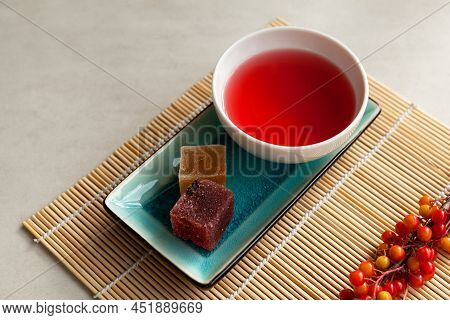 Schizandra Tea On A Bamboo Mat. Selective Focus. Traditional Ancient  Korean Drink Is Brewed From Ch