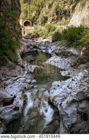 Mountain River In The Gorge Of Mountains Near The City Of San Pelegrino In Italy