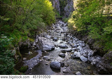 Mountain River In The Gorge Of Mountains Near The City Of San Pelegrino In Italy