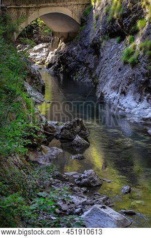 Mountain River In The Gorge Of Mountains Near The City Of San Pelegrino In Italy