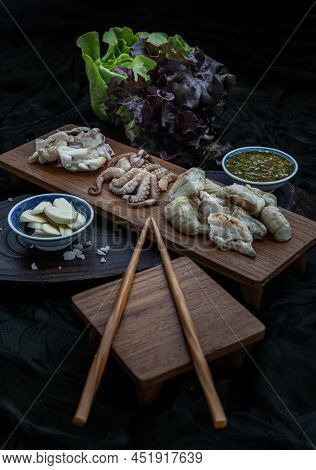 Fresh Grilled Squid, Octopus Tentacles And Squids Eggs On Wooden Tray Served With Fresh Vegetables, 