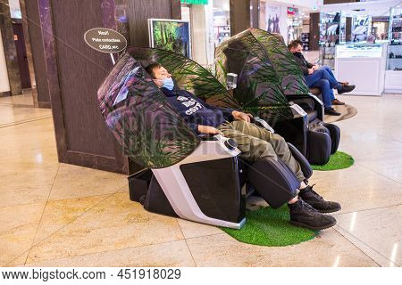 Iasi, Romania Murch 2022 - Man Wearing A Medical Mask Due To The Coronavirus Covid 19 Relaxing On Th