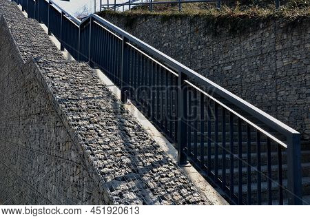 Construction Of A Steep Staircase By The Stone Wall Car Park With High Durability Even Under Heavy L