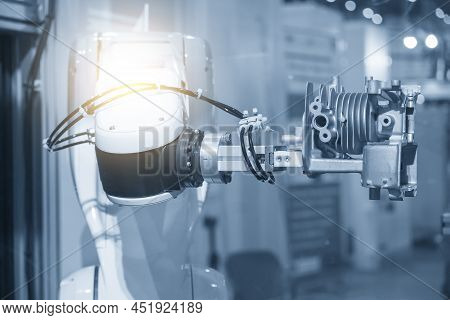 The Hi-technology  Material Handling Process By Robotic System With Cylinder Block Parts. The Automa