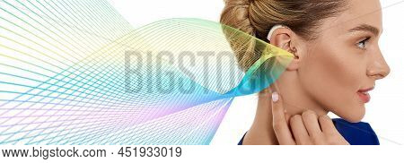 Woman With Hearing Aid Behind The Ear With Colorful Sound Waves Showing Variety Of Sounds Going To T