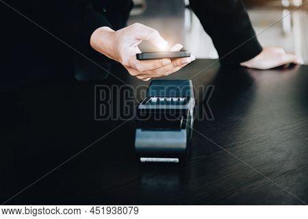 Secure Payment Technology Concept And Service Charge, Customers Are Using Their Phone To Pay Using P