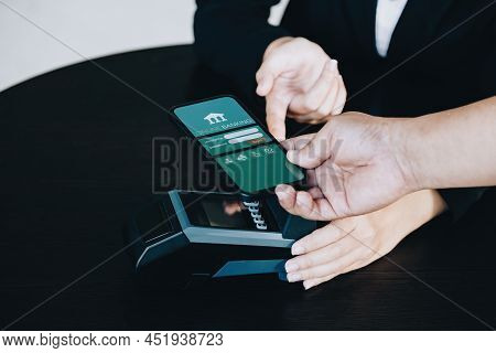 Payment Security Technology Concept And Service Fees, Employees Are Holding Electronic Card Machines