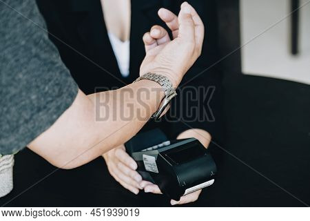 Payment Security Technology Concept And Service Fees, Employees Are Holding Electronic Card Machines