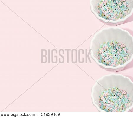 Several Bowls Full Of Microplastics On A Pink Background. Impact Of Micro Plastic In Food Chain. The