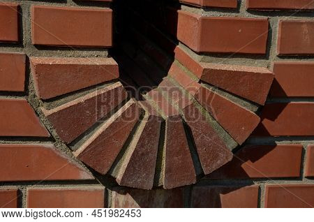 Stairs And Railings Of Exposed Brick Smooth Surface. Metal Railings And Benches In The Corners Of Th