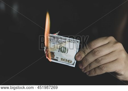 Hands And Burnning Money - Business Concept. Concept Of Inflation. Abandoning The Dollar