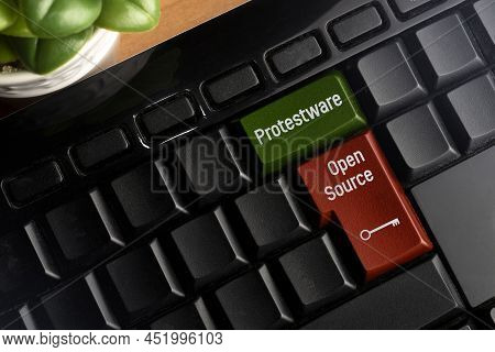 Protestware And Open Source Key On A Pc Keyboard. Protestware Is When A Programmer Insert Malicious 