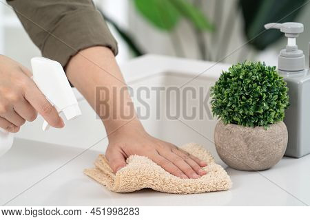 Woman Housewife Is Doing The Spring Cleaning At Home Kitchen.