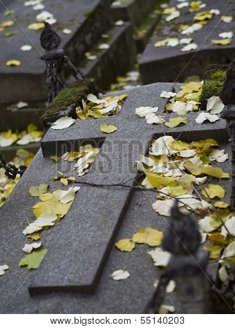 old nameless tombstone in cemetery setting shallow depth of field
