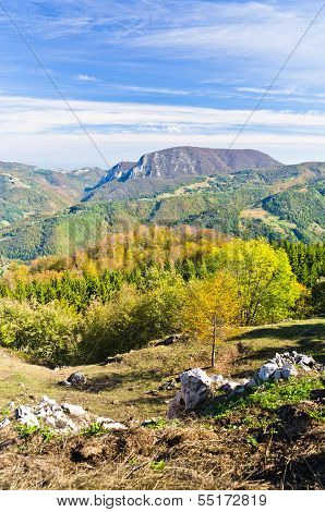 Viewpoint on a landscape of mount Bobija, peaks, hills, rocks, meadows and colorful forests