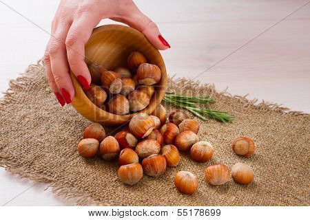 Hazelnuts, filbert on old wooden background