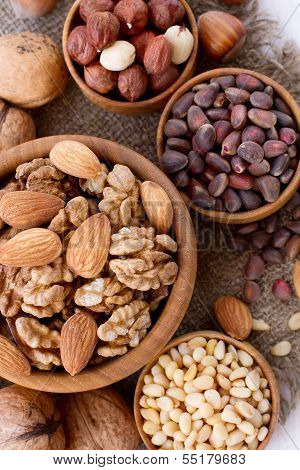 Hazelnuts, filbert on old wooden background