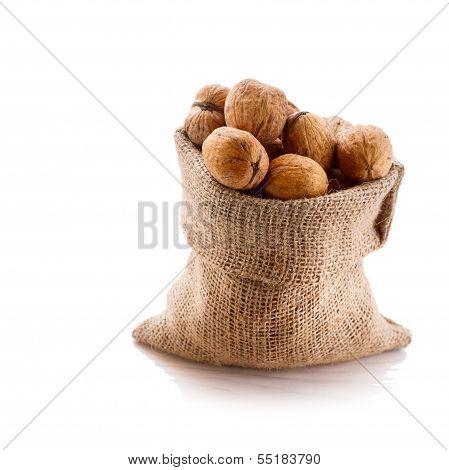 Hazelnuts, filbert on old wooden background
