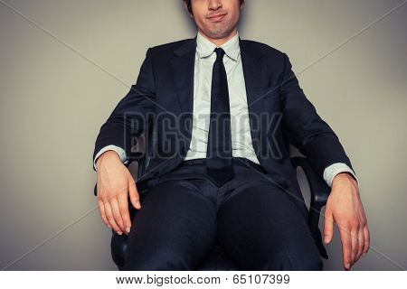 Businessman Sitting In Office Chair