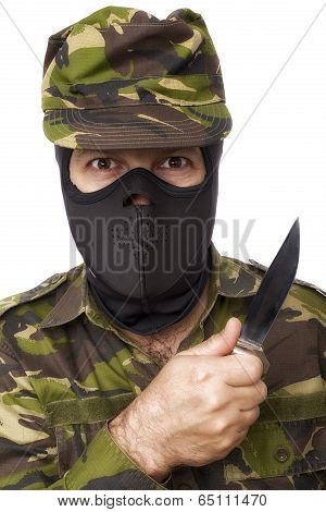 Male Self Defense Instructor With Camouflage Do A Self Defense Exercise With Knife, Isolated On Whit