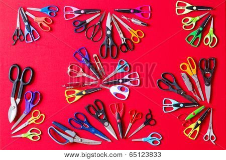 Random Groups Of Multiple Scissors Conceptualy Laid On Red
