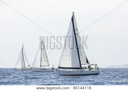AEGEAN SEA, GREECE - APR 27, 2014: Unidentified sailboats participate in sailing regatta 