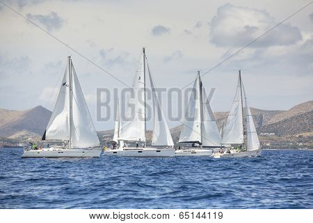 AEGEAN SEA, GREECE - APR 27, 2014: Unidentified sailboats participate in sailing regatta 