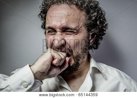 derision, man with intense expression, white shirt