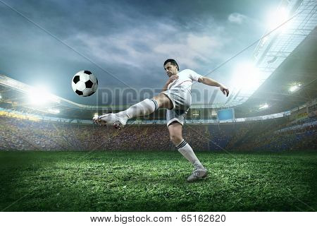 Soccer player with ball in action outdoors.