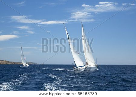 AEGEAN SEA, GREECE - MAY 4, 2014: Unidentified sailboats participate in sailing regatta 