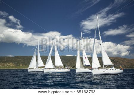 AEGEAN SEA, GREECE - MAY 4, 2014: Unidentified sailboats participate in sailing regatta "11th Ellada 2014" on Aegean Sea.