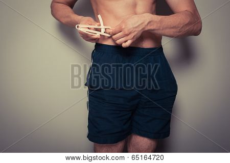 Young Man Measuring His Body Fat