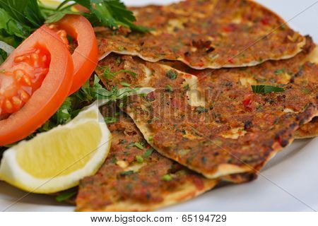 Homemade traditional Turkish meal pide stuffed with meat cheese,  and sauce isolated on white background