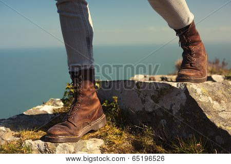 Young Woman Walking In The Mountains